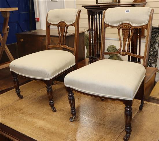 A pair of Edwardian inlaid rosewood salon chairs